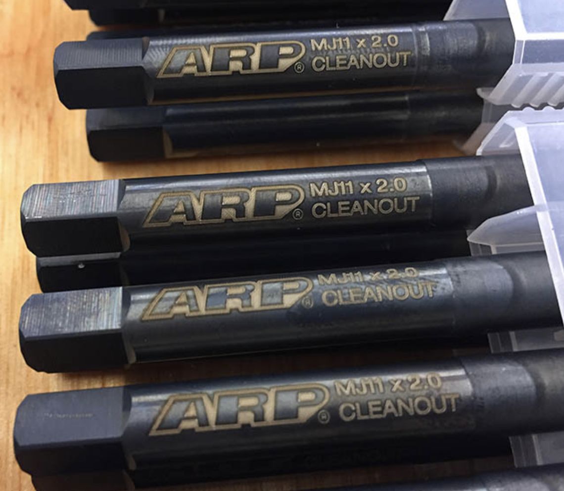Black steel tools laser marked in gold with a brand name and size