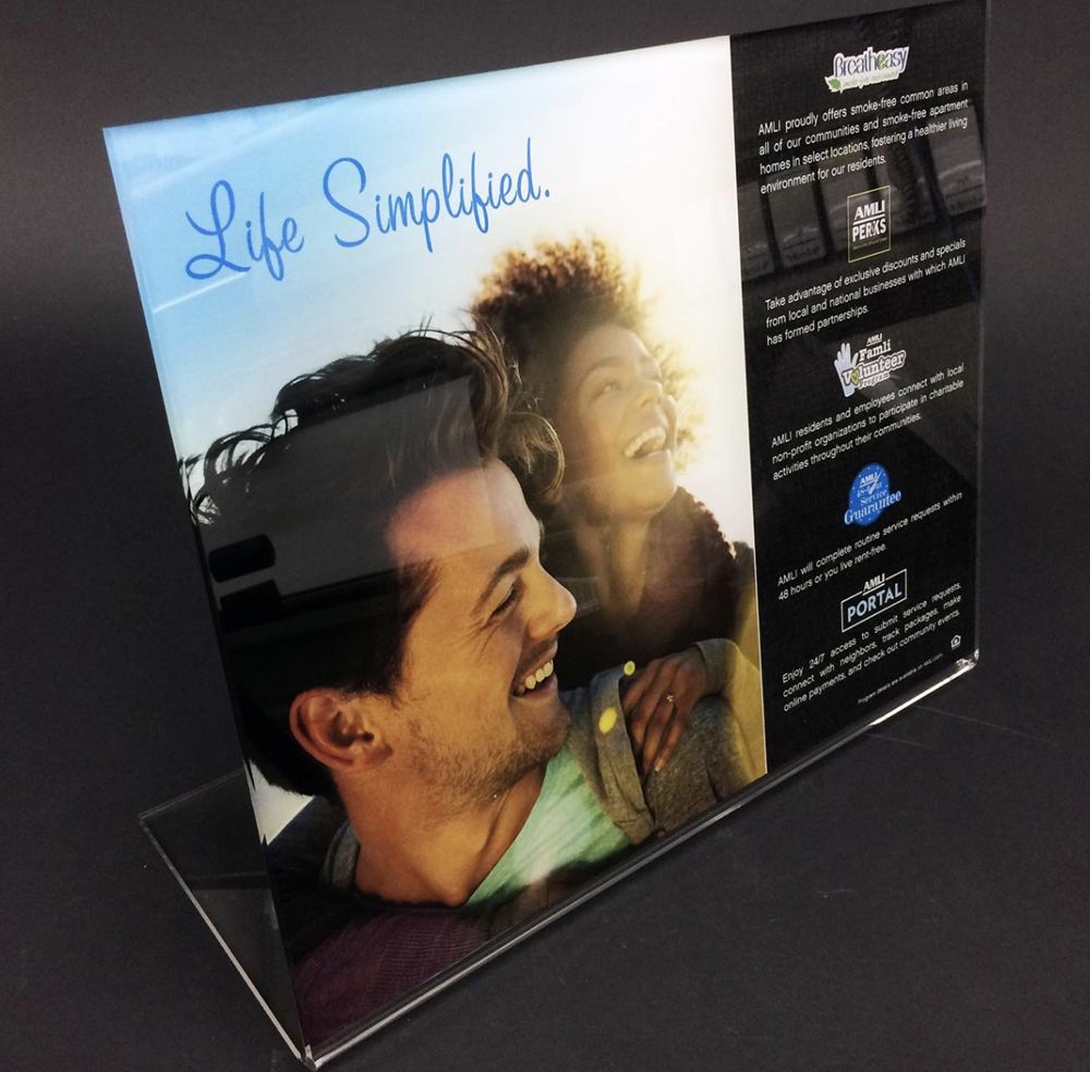 Clear acrylic counter sign printed with a full color photo and text