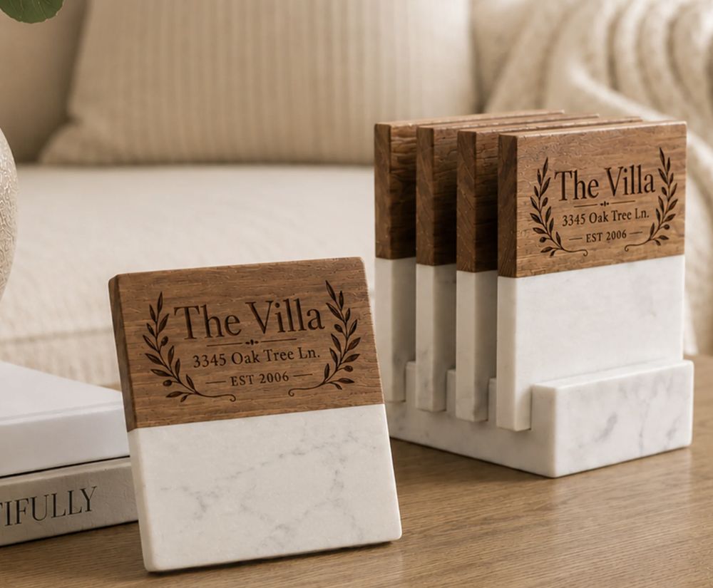 Wood and marble coaster set engraved with a home name, address and laurel wreath
